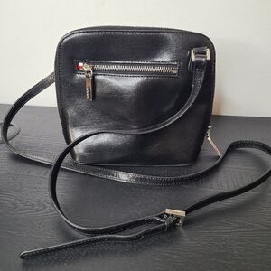 Small square HOBO Original black leather bag with red lining